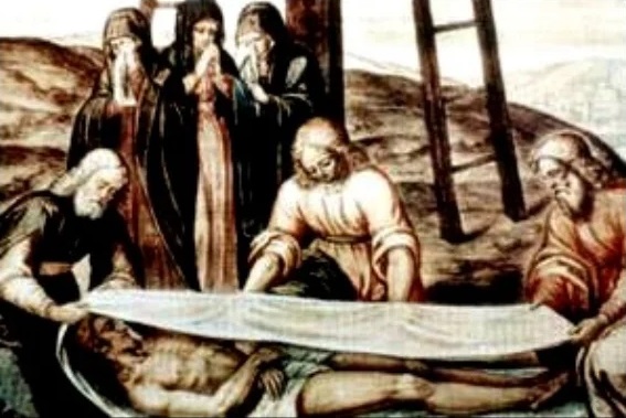 Colocaci&oacute;n de la S&aacute;bana Santa sobre el cuerpo de Jes&uacute;s